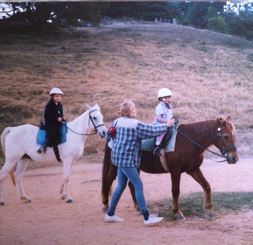 Little 5-year-old Rikki on Red - she grew up riding Red